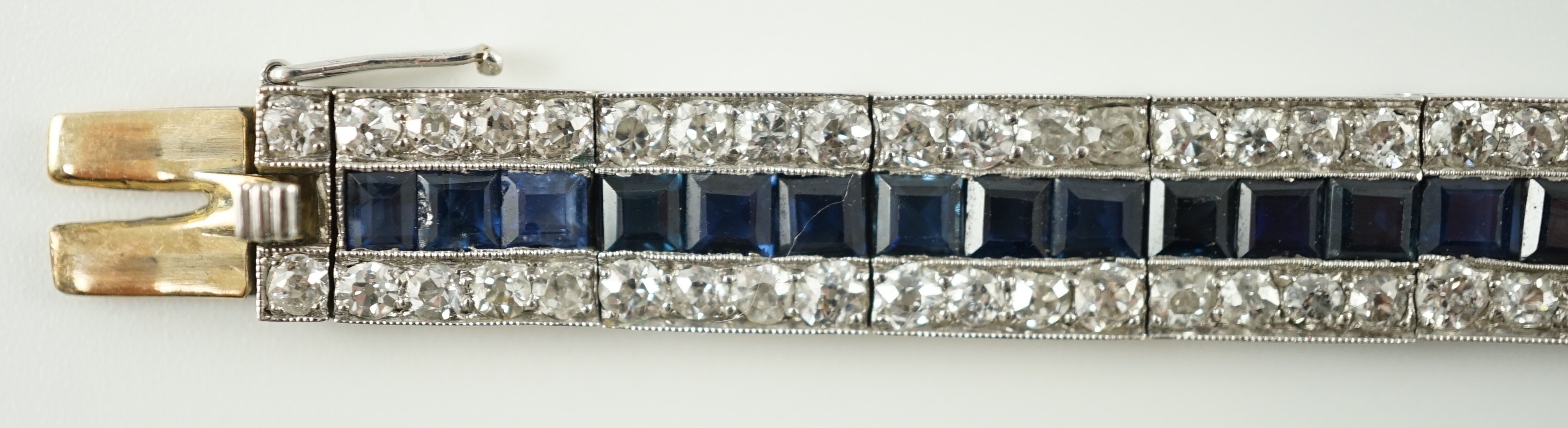 A 1920’s white gold, sapphire and diamond set triple line bracelet